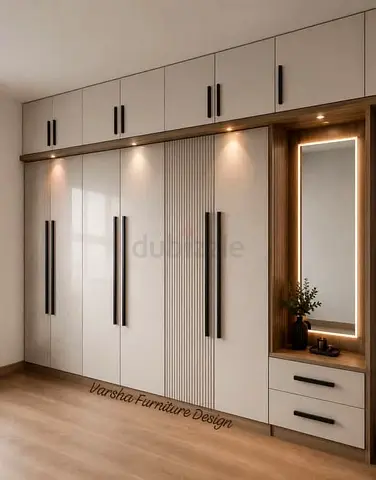 Modern built-in wardrobe with illuminated vanity and overhead storage