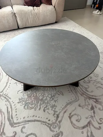 Round modern coffee table with dark base — 100cm (approx) condition good