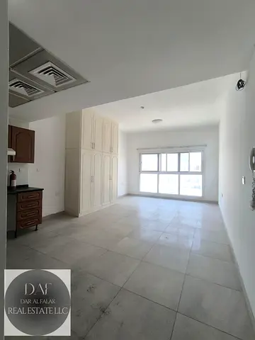 STUDIO FLAT LARGE IN SIZE OPEN KITCHEN AVAILABLE BEHIND MADINA MALL IN MUHAISNAH 4 TOWARDS GULF MODEL SCHOOL AND NEW DAWN PRIVATE SCHOOL