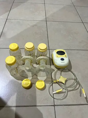 Electric breast pump kit with multiple bottles and accessories (used)