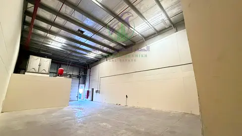 2,000 sqft storage warehouse in Ind Area 18, Sharjah. Near main road, includes office & washroom. Rent: AED 105k in 4 cheques.