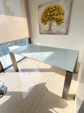 Glass Top Dining Table with Stainless Steel Legs - Good Condition