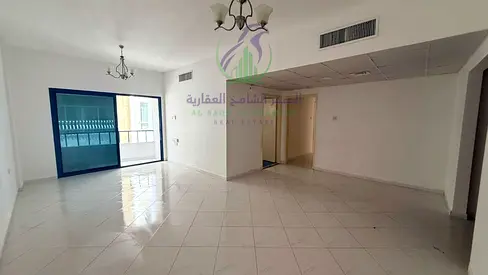 2BR Apartment for Annual Rent in Al Majaz 3 with Bachelor Contract Balcony Open View Wall Closets Spacious Layout and Modern Finishing Ideal for Livin