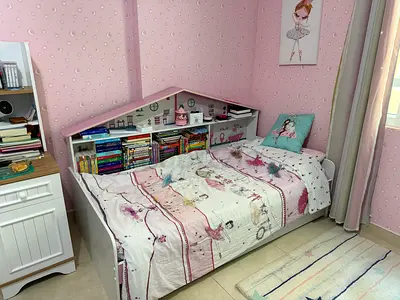 White single bed frame with storage shelves — great condition