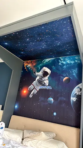 Kids bedroom space-themed wall mural with astronaut panel