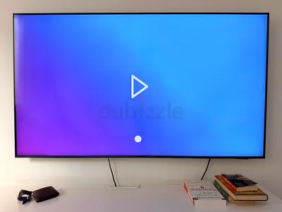 Samsung crystal 4k 65-inch LED Smart TV mounted on wall - good condition
