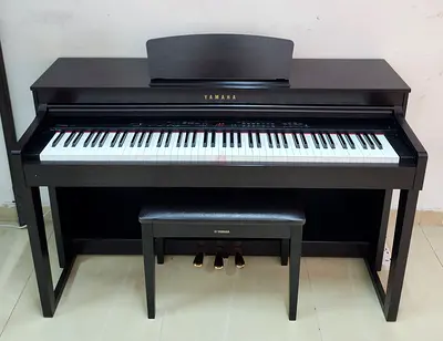 The Yamaha Clavinova CLP-430R (Rosewood finish) is an 88-key digital piano featuring Graded Hammer