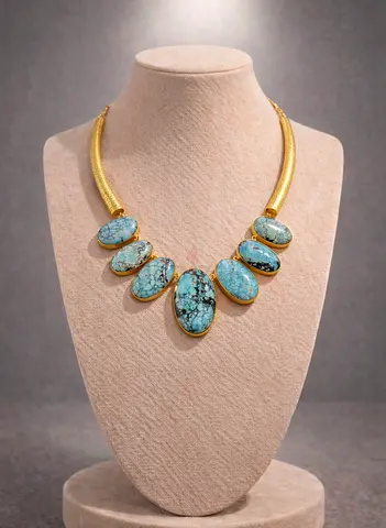 Gold-tone statement necklace with turquoise stones