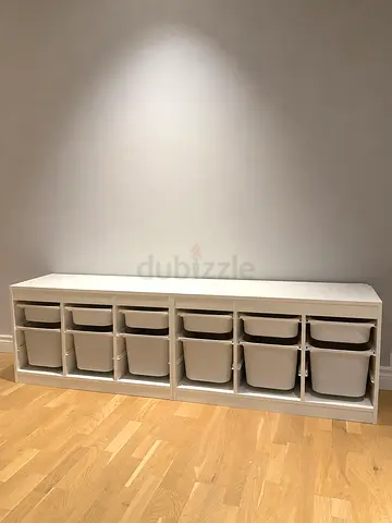 Ikea: White kids storage unit with shelves and pull-out bins