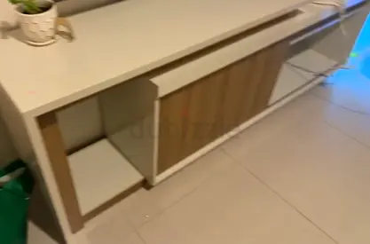 Modern low TV cabinet / media console with sliding doors - light wood & white