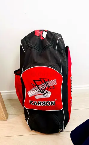 Red Karson sports bag kit with helmet and pads- used, good condition