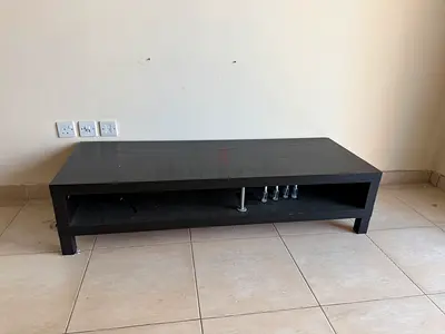 Low black TV/entertainment unit with open shelf