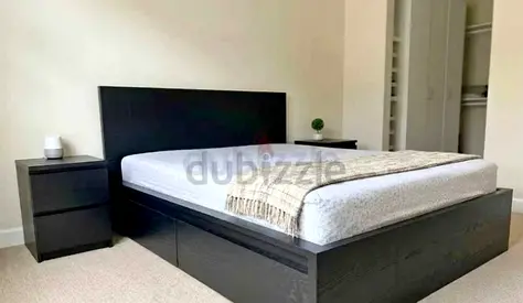 IKea king  size bed with mattress and storage drawers