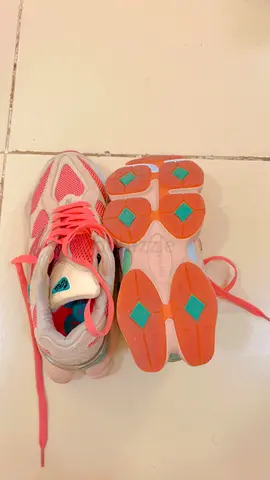 Lightly used pink women's running shoes - size