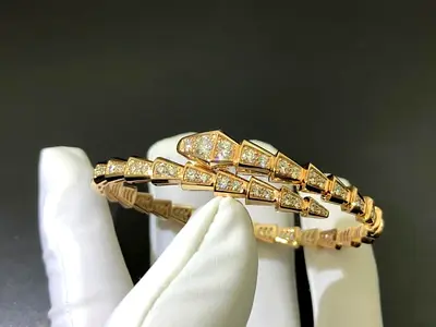 Gold tone bracelet with pavé CZ stones - snake/scale design master Quality