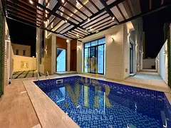 An exceptional opportunity: a corner villa with custom finishes; electricity and water charges are i