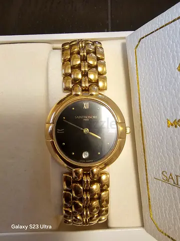 Gold-tone Saint Honore women's / men s wristwatch with black dial - used