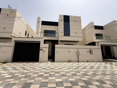 A brand-new villa (first occupant) with an area of 3,200 square feet, featuring 5 bedrooms, 8 bathrooms, two living areas, a majlis, and a maid's