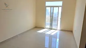 Spacious 1BR apartment for annual rent with 2 bathrooms, balcony, and built-in wardrobes, excellent 