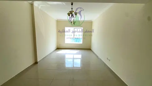 غرفتين وصالة للإيجار السنوي في التعاون، على مخرج دبي، غرفتين ماستر، غرفة خادمة أو ستور، مطبخ واسع، باركن مجاني