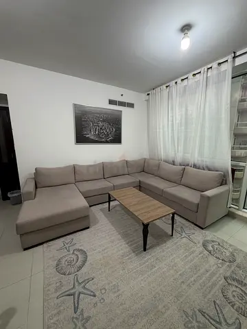 L-shaped beige fabric sectional sofa with ottoman - excellent condition