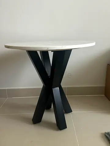 Round coffee Table with White marble Top and Black Crossed Legs