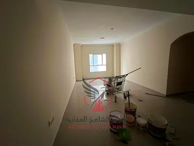 2BR + Hall in Al Nad, Free Parking & Balcony. Prime location near cafes, shops & Dubai exit.