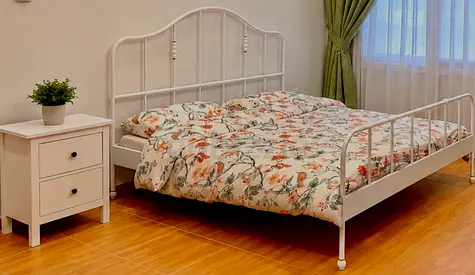 White Metal Double Bed Frame with Floral Bedding - Good Condition