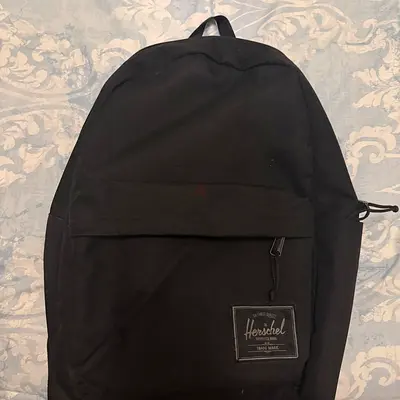 Black Herschel backpack — classic everyday pack