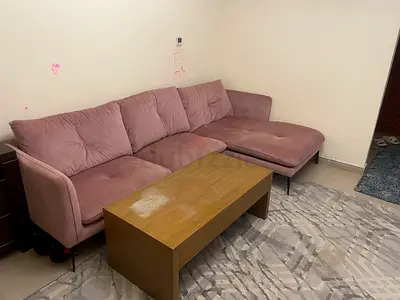 Light-pink L-shaped fabric sofa with chaise, good condition