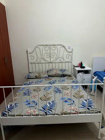 White metal double bed frame with headboard and footboard