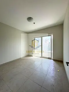 Modern 2BR Apartment with Free Parking and balcony in Al Taawun