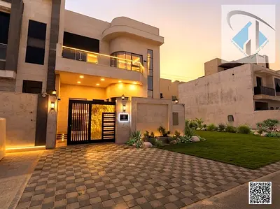 Villa for sale in Al Helio, Ajman—registration fees included. Features 5 master bedrooms, a majlis, a living area, and a maid's room. Freehold ownersh