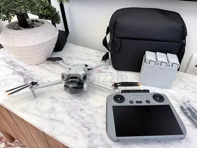 DJI Mini 4 Pro series foldable drone with controller and extra batteries - used once