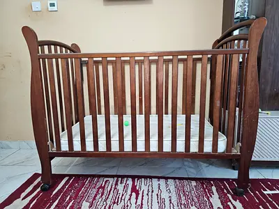 Solid wood baby crib with mattress - gently usedo