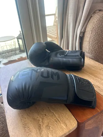 Barely used black Venum boxing gloves - good condition