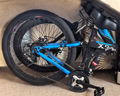 Blue strong and new bike with training wheels - good condition