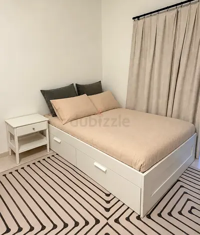 White wooden single bed with storage drawers - good condition. Includes matress