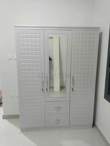 Brand new model 3 door white cabinet with mirror and have 2 drawers
