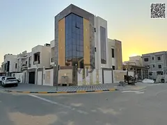A new corner villa for sale in Al Amerah, Ajman; featuring five master bedrooms, a modern design, an