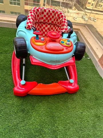 Used baby walker with activity tray and padded seat