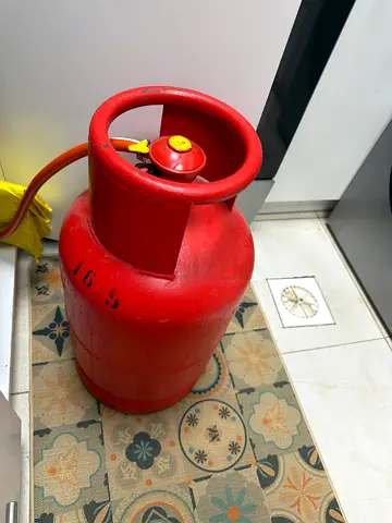 Used Red LPG Gas Cylinder with Hose and actuator - about 3/4 full -clean and great working condition