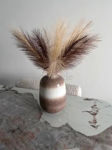 Decorative ceramic vase with pampas grass arrangement