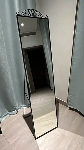 Full-length freestanding mirror with decorative metal frame