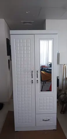 White freestanding wardrobe with mirror and drawer