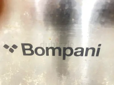 Bompani stainless steel kitchen appliance (used) - brand close-up, 2 burner needs service.