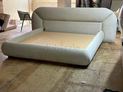 Modern upholstered king-size bed frame with curved headboard - light beige