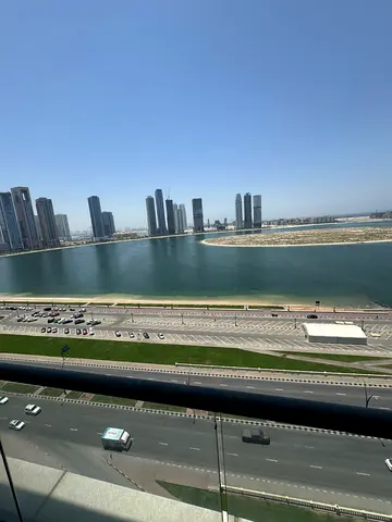 3 bedrooms and a living room in Sharjah with direct sea views, free air conditioning, free gym and pool with one month free, master bedrooms with buil