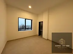 For annual rent in Ajman (Al Aliyah area): a unit featuring two master bedrooms and a spacious livin