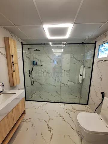 Shower partition with sliding door